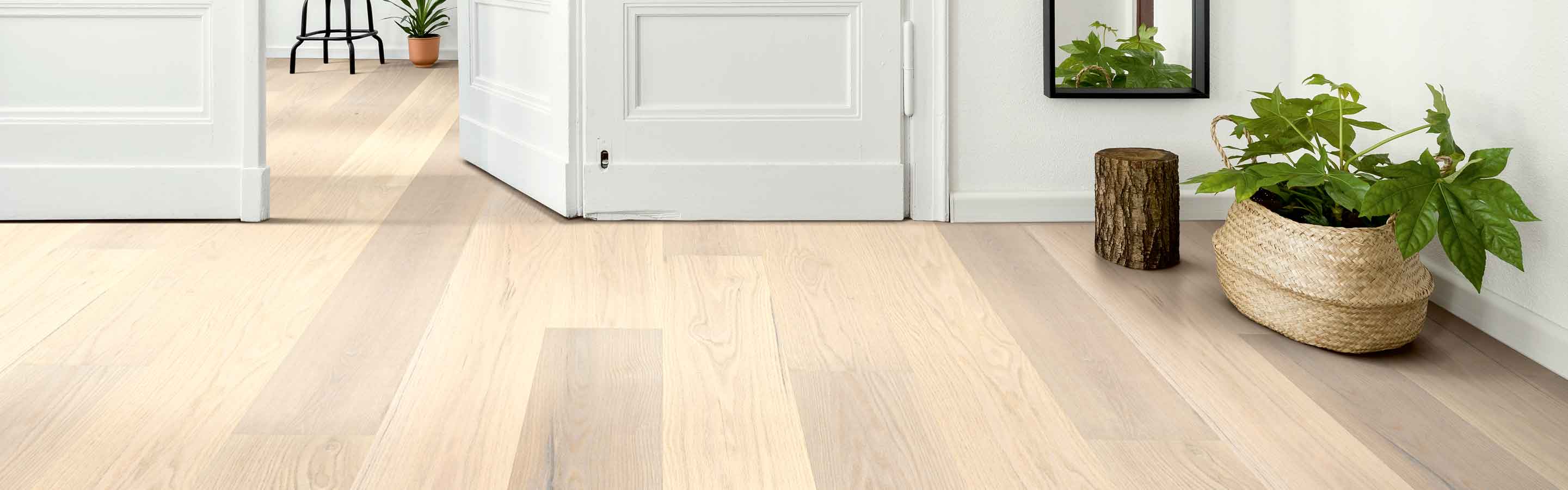 white oak hardwood in modern entryway with full length mirror, plants and wood accents