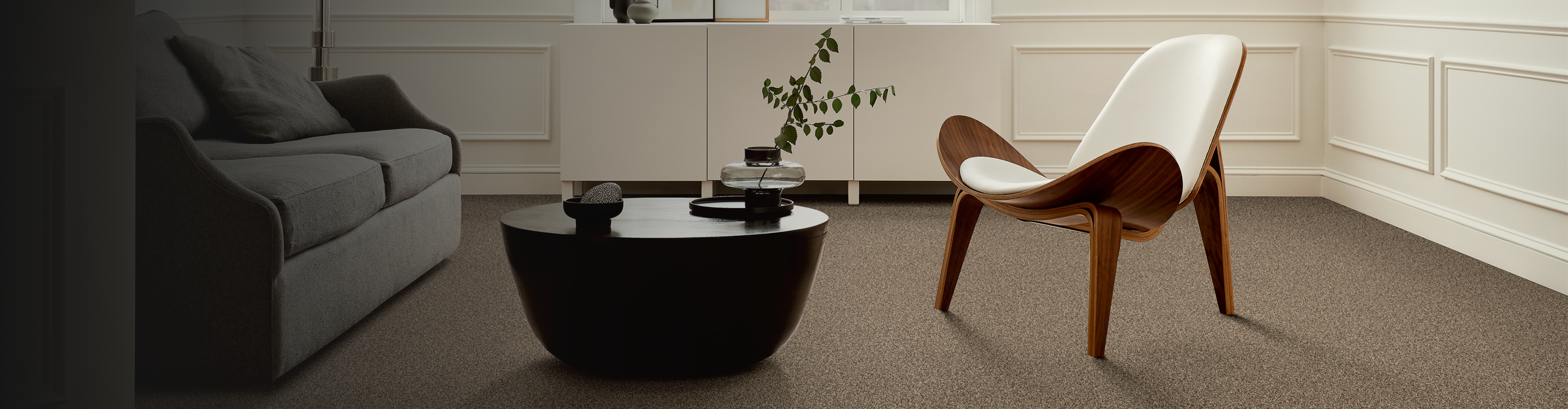 Living room with modern chair and brown carpet